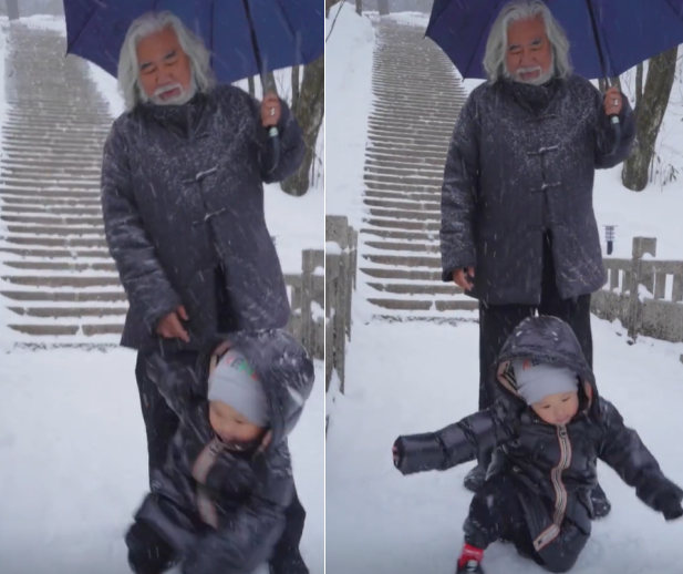 70岁张纪中携娇妻赏雪 为妻子撑伞驻足拍照太有爱